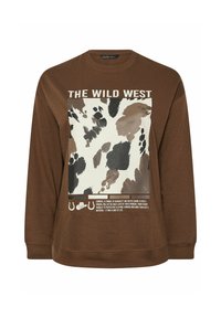 Brązowa bluza z dużą białą i brązową grafiką przedstawiającą wzór w krowie plamy oraz napisem "DZIKI ZACHÓD". Rękawy z mankietami i luźny krój.