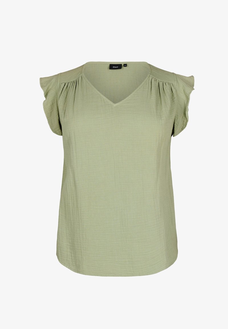 Svetlo zelena bluzica z V-izrezom in kratkimi nabrano rokavi, teksturirana tkanina in sproščen kroj. Oznaka nosi "Zizzi."