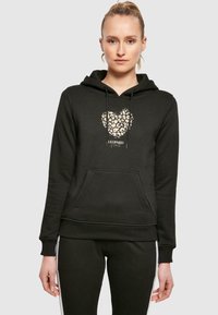 Black hoodie with a leopard print heart design, featuring a front pocket and drawstring hood, made from soft, textured fabric.
