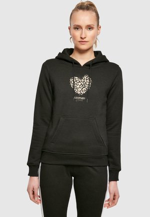 Black hoodie with a leopard print heart design, featuring a front pocket and drawstring hood, made from soft, textured fabric.