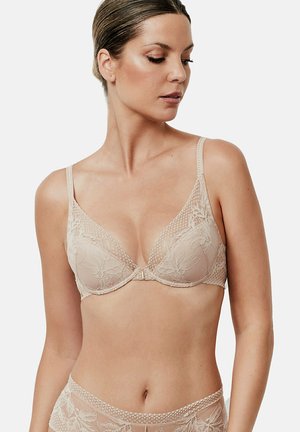 Lichtbeige kanten bh met driehoekige cups, decoratieve bloemmotieven, dunne verstelbare bandjes en een haaksluiting aan de voorkant in het midden.