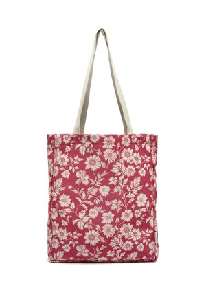 Sac cabas en tissu rouge avec motif floral blanc et anses écrues sur fond blanc.