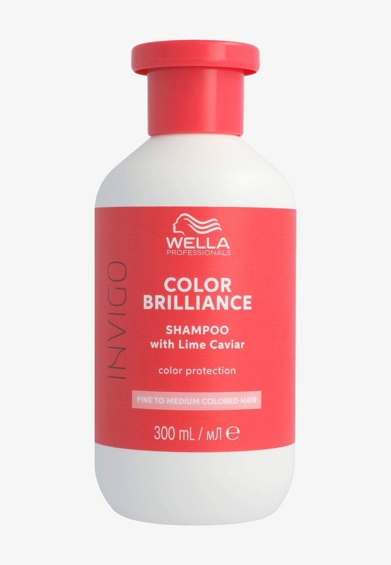 Shampoo Wella Professionals Color Brilliance in una bottiglia bianca e rosa, presenta una forma liscia e arrotondata con un tappo rosso a vite, etichettato per capelli colorati da fini a medi.