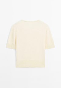 Maglione a maniche corte lavorato a maglia in crema chiaro con scollatura rotonda, polsini e orlo a coste, caratterizzato da una texture liscia e un design minimalista.