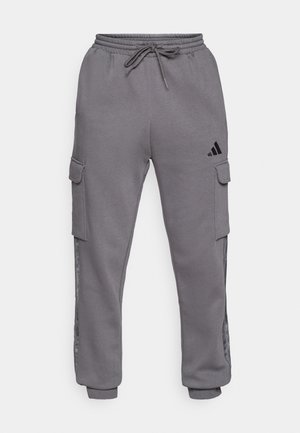 Grijze cargo-sweatpants met elastische tailleband en trekkoord, voorzien van zijzakken en zwarte logodetails, textuurstof, taps toelopende boorden.