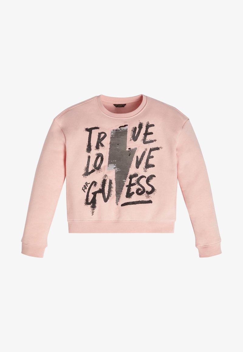 Vaatevihreä svetari, jossa on pyöreä kaula-aukko, pitkät hihat ja lyhyt malli. Koristeena musta ja hopeanvärinen salamalla varustettu graafinen teksti.