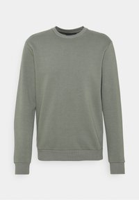 Sudadera verde hecha de tela suave, con cuello redondo, mangas largas y puños y dobladillo acanalados para un ajuste ceñido.