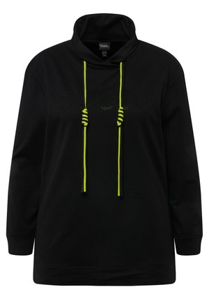 Černá mikina s kapucí, zdobená neonově žlutými stahovacími šňůrkami a nápisem 'GLOW' v třpytivém provedení na přední straně. Měkká tkanina a volný střih.