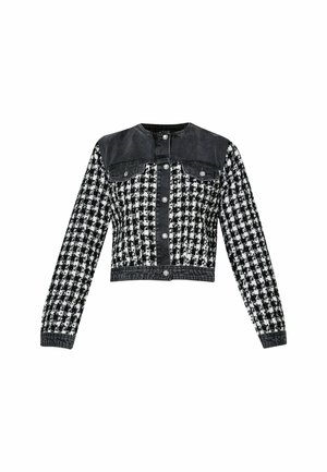Jachetă croppată cu partea superioară din denim negru și un model houndstooth în alb și negru. Prezintă nasturi tip snap și două buzunare frontale.