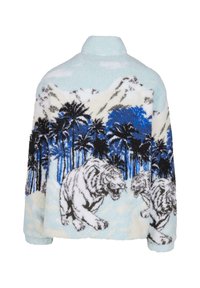 Fuzzy pullover jacket in light blue featuring a jungle scene with white tigers, palm trees, and mountain silhouettes. Soft texture.