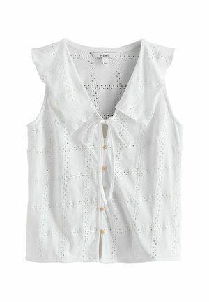 Biała bezrękawnikowa bluzka z ażurowej tkaniny, z dużym spiczastym kołnierzem, zapięciem na guziki z przodu oraz wiązaniem przy dekolcie.