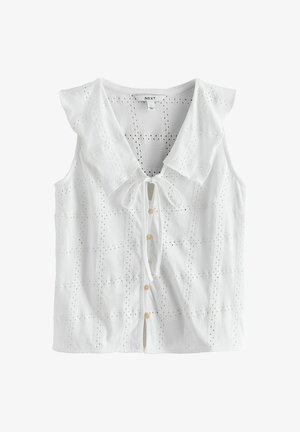 Biała bezrękawnikowa bluzka z ażurowej tkaniny, z dużym spiczastym kołnierzem, zapięciem na guziki z przodu oraz wiązaniem przy dekolcie.