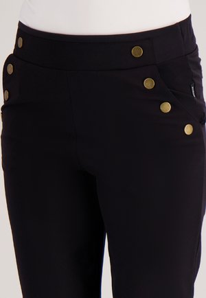 Zwarte stretchbroek met een aansluitend ontwerp, voorzien van gouden knopen op de tailleband en zijzakken voor extra detail.