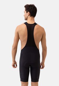 Pantaloni da ciclismo neri con bretelle, dotati di schiena in rete, fondello imbottito e aperture elastiche alla gamba. Tasche laterali per riporre piccoli oggetti. Materiale resistente per il massimo comfort.