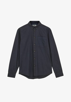 Navy blue long-sleeve shirt made of cotton, featuring a button-down collar, front pocket, and a slightly curved hem. Smooth texture.