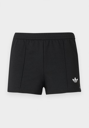 Shorts de sport noirs avec une ceinture élastique et un petit logo trefoil blanc d'Adidas sur la jambe gauche.
