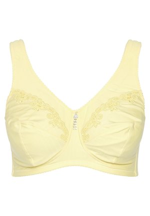 Reggiseno giallo realizzato in morbido tessuto, con ricami floreali sulle coppe, dotato di un elemento decorativo centrale e spalline larghe per un migliore supporto.