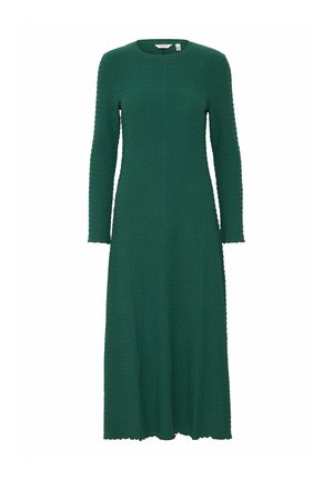 Zielona, długa sukienka z długimi rękawami, uszyta z teksturowanej tkaniny. Ma okrągły dekolt i luźną sylwetkę, z falbaniastym dołem.