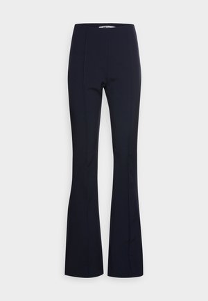 Pantalon évasé bleu marine avec taille haute et couture avant dissimulée, présenté sur un fond clair uni.