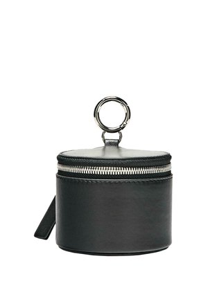 Black cylindrical leather pouch with silver zipper and large silver keyring attached on top against white background.