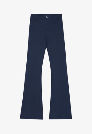 Pantalons évasés navy en tissu extensible avec une large ceinture et une texture lisse. Présente un logo subtil près du haut.