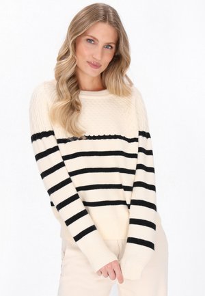 Maglione lavorato a maglia crema con strisce orizzontali nere, scollatura rotonda e polsini a costine. Presenta un motivo testurizzato nella parte superiore.
