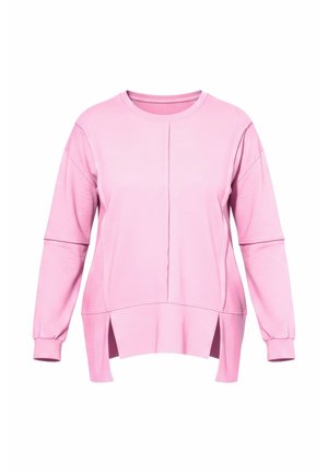 Lyserød sweatshirt med lange ærmer, afslappet pasform, sideslidser og rund hals. Fremstillet af blødt stof med synlige sømdetaljer.