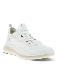 White sneaker with a textured upper, contrasting gray accents, round toe, lace-up closure, and cushioned sole for comfort.