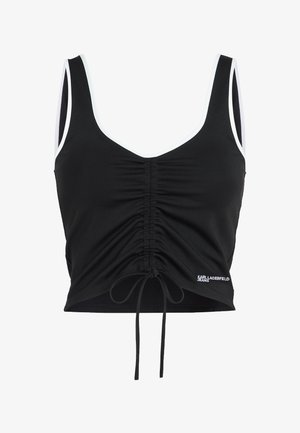 Bluza crop top neagră fără mâneci, cu margine albă, față centrală strânsă cu șnur reglabil și mic logo „Karl Lagerfeld Jeans” la tiv.