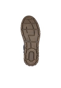 Semelle de chaussure en caoutchouc marron avec un motif de grip texturé, des sections délimitées et un logo en relief. Taille 37 indiquée sur la semelle.