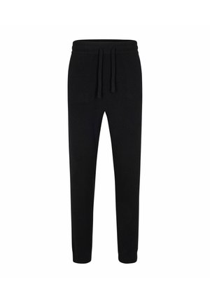 Czarne spodnie dresowe z miękkiego materiału, z elastycznym pasem i sznurkiem, zwężane nogawki, bez widocznych wzorów ani akcentów.