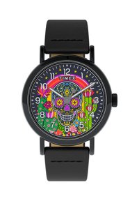 Reloj Timex con correa de cuero negra, que presenta un diseño colorido de calavera en la esfera, rodeado de patrones florales y un arco iris.