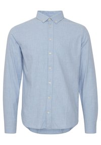 Light blue long-sleeve button-up shirt made of soft fabric. Features a collar, a front placket with buttons, and a curved hemline.