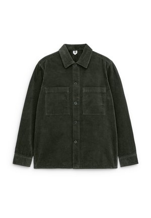 Dark green corduroy shirt with a button-up front, collar, and two chest pockets. The fabric features vertical ridges and a soft texture.