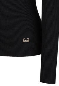 Schwarzes geripptes Langarmshirt mit taillierter Passform. Inkludiert ein goldenes Logo-Detail mit "1969" auf der unteren linken Seite. Weicher Stoff.