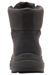 Bottines noires avec un dessus texturé, un doublure en peluche et une semelle en caoutchouc plate. Dotées d'une boucle en tissu à l'arrière pour un enfilage facile. Marque Roxy sur le talon.