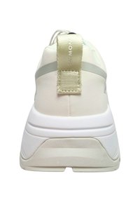White athletic shoe with a textured heel, smooth upper fabric, and a pull tab. Features a contrasting light grey stripe.