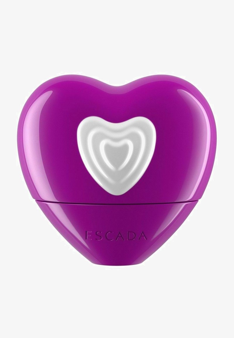 Violetti sydämenmuotoinen parfyymipullo, jossa on valkoinen sisäsyli, kiiltävä pinta ja kohokuvioitu "ESCADA" pohjassa.