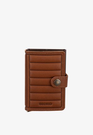 Brown leather Secrid wallet with horizontal padded lines, a snap button closure, and visible stitching on a white background.