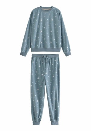 Ljusblått avslappnat set i mjukt tyg, bestående av en sweatshirt med rund hals och joggers med elastisk midja, båda med vita snöflinge-mönster.