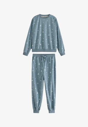 Hea sinine mugavusriiete komplekt, mis on tehtud pehmest kangast, sisaldab ümmarguse kaelusega sussisärki ja elastse vöökohtaga spordihartu, mõlemad valgete lumehelvesemustritega.