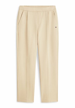 Pantaloni beige a gamba dritta con tasche laterali, vita elasticizzata e piccolo logo Tommy Hilfiger sull'anca destra.