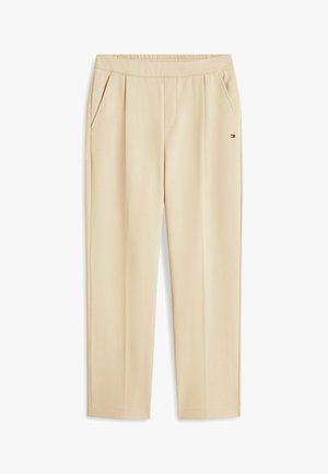 Beige bukser med lige ben, sidelommer, elastisk talje og lille Tommy Hilfiger-logo på højre hofte.