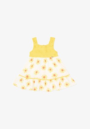 Vestido amarillo sin mangas para niño pequeño con parte superior de encaje y falda blanca con patrón floral de margaritas amarillas y naranjas y dobladillo con volantes.