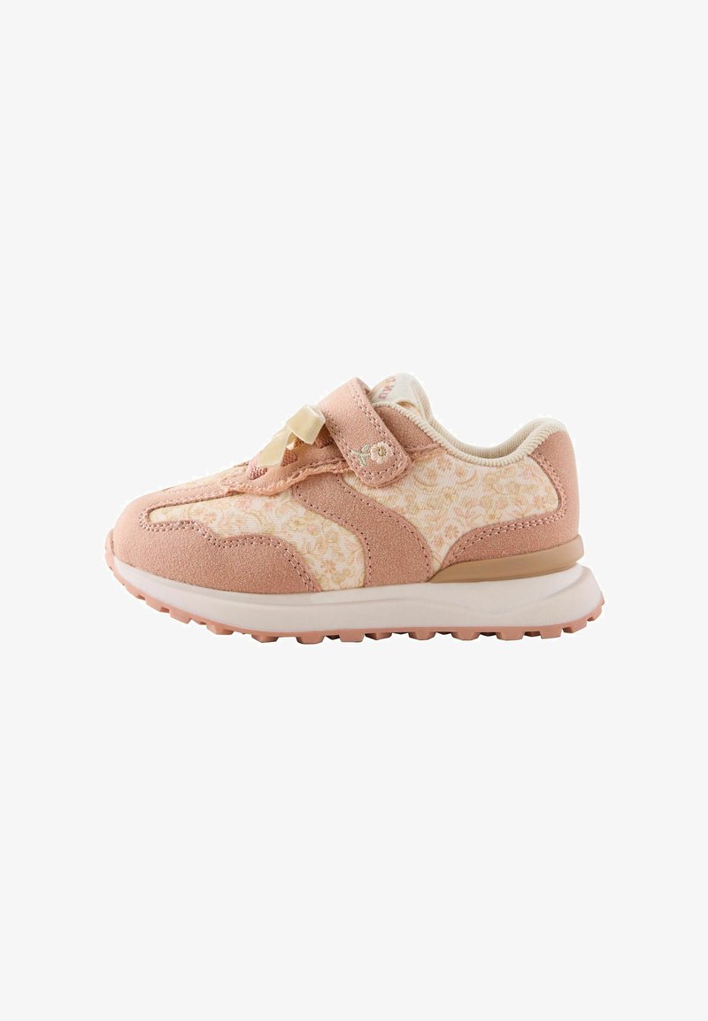 Child's pink and cream sneaker with floral pattern, Velcro strap, rubber sole, and decorative bow on top, shown from the side.