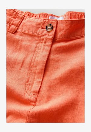 Kerge, oranž linane kangas sileda tekstuuriga. Omadusteks on nööpide sulgemine, elastne vöökoht ja korrapärased õmbluse detailid.