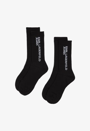 Mustad puuvillased sokid ribidega, mille külgedel on valge tikand "KARL LAGERFELD JEANS" brändingu nimi. Keskmise sääre pikkusega.