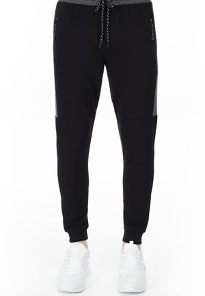 SLIM FIT - Pantaloni sportivi - black