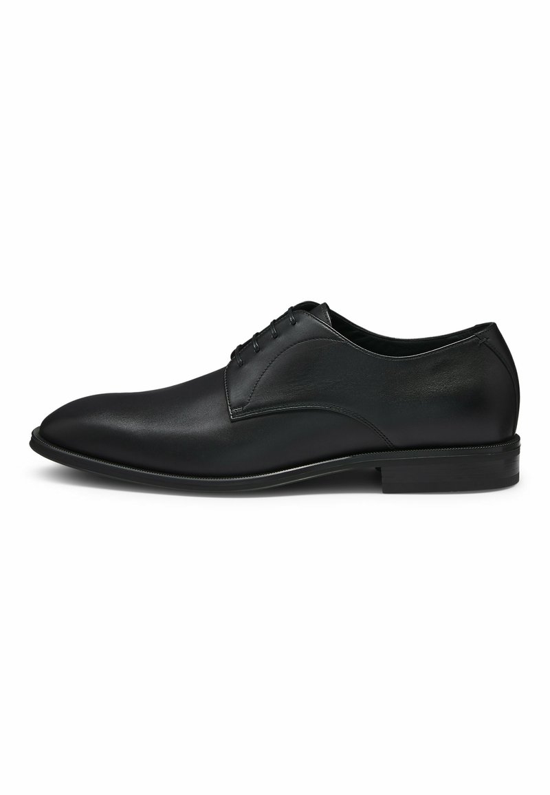 Black leather dress shoe featuring a smooth finish, rounded toe, and five eyelet lace-up design with subtle stitching accents.