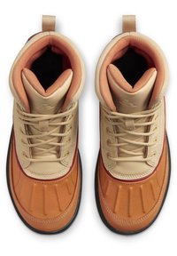 Tan and brown high-top boots featuring a smooth leather upper, padded collar, round laces, and a textured rubber sole.